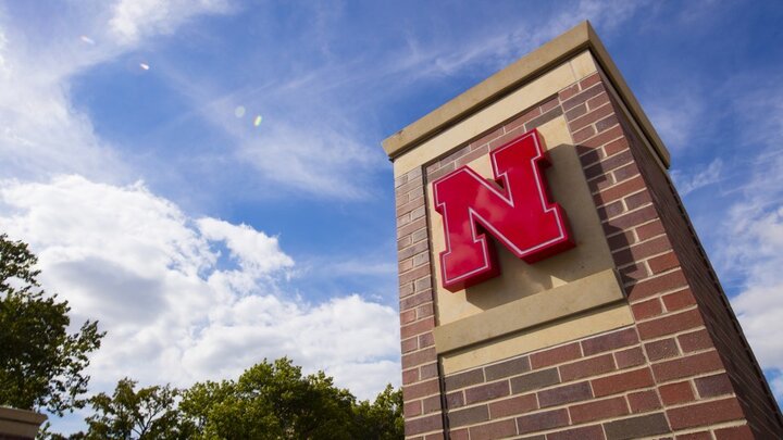 An arch with the Nebraska "N"